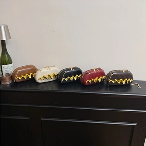 Chic oval box clutch bags in five colors with wavy gold metal trim and chain straps