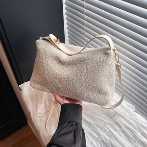 Minimalist white faux shearling tote bag with golden metal buckle and smooth shoulder strap