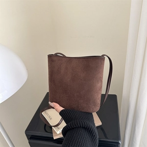 Brown suede leopard style bucket bag with adjustable strap for women in 2025