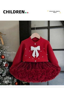 Detail of girls red knit cardigan with sequin bows and layered burgundy tutu skirt