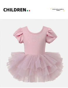 Close-up of pink girls ballet leotard with rhinestones and multi-layer tulle tutu skirt