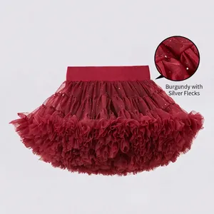 Detail of wine red tutu skirt showing elastic waistband and silver glitter mesh fabric