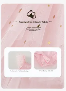 Detail of pink ballet leotard featuring golden star prints and convenient bottom snaps