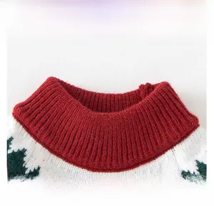 Close-up of red ribbed mock neck sweater with festive winter cedar pattern