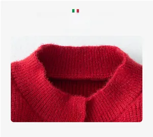Close-up of red knit sweater featuring a silver luxury E-button and plush texture
