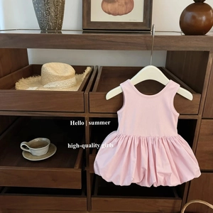 Sleeveless pink bubble dress for toddler girls featuring a sweet open back summer style
