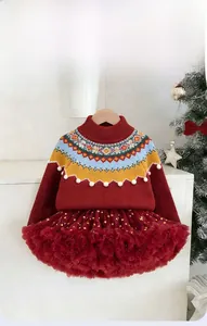 Detail of red knitted sweater with jacquard collar and sequined mesh tutu skirt for girls