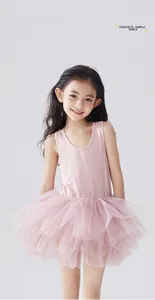 Detail of baby pink sleeveless tutu dress featuring voluminous layered mesh skirt