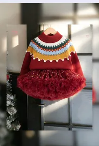 Detailed view of red knit sweater collar with colorful patterns and tutu skirt