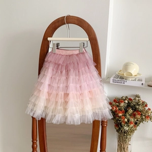 Close-up of pink gradient layered tulle tutu skirt with soft pleated ruffles for girls