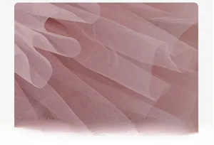 Detail of pink multi-layer mesh fabric with soft texture and fluffy tutu skirt design