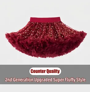 Detail of red tutu skirt featuring gold star patterns and a comfortable elastic waistband