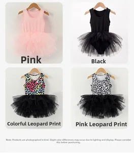 Detail view of girls' ballet tutus in pink, black, and leopard print on hangers