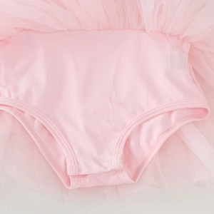 Detail of pink ballet leotard featuring multi-layer tulle tutu and high-elastic knit fabric