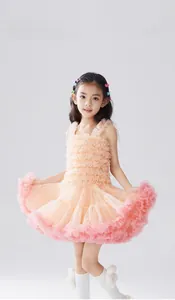 Detail of girls tiered tutu dress with multi-layered pink mesh and pleated bodice texture