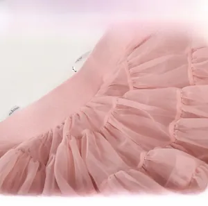 Close-up of pink layered tutu skirt showing soft elastic waistband and mesh texture