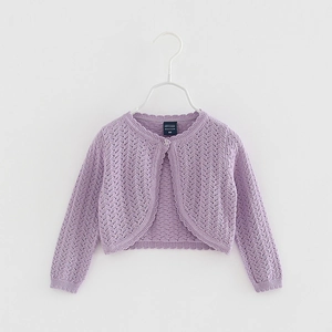 Detail of purple knit cardigan for girls with hollow diamond pattern and scalloped edges