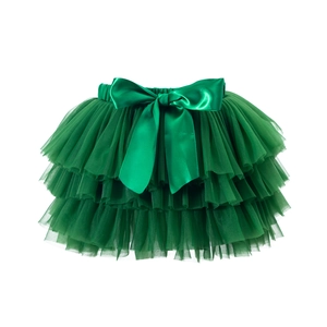 Detail of vibrant green multi-layer tutu skirt with large satin bow and elastic waist