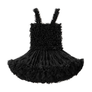 Detailed close-up of girls black star-tulle dress with layered ruffles and silver sequins