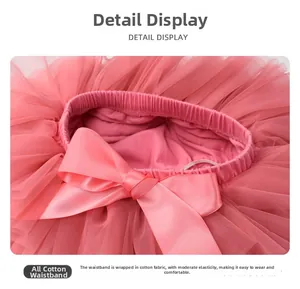 Close-up of pink layered tulle tutu skirt with elastic cotton waistband and satin bow