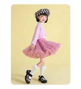 Detail view of multi-layered pink mesh tutu skirt for girls with voluminous tulle texture