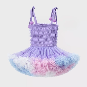 Detail of girls purple tutu dress featuring adjustable straps and layered tulle fabric