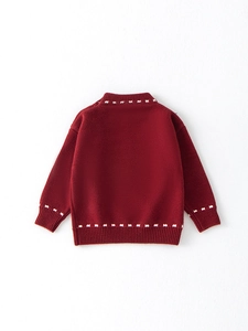 Deep red festive knitted sweater for girls with white geometric patterns on edges
