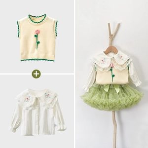 Dettaglio del set gonna tutu da neonata con bordo in pizzo e gilet a fiori ricamati