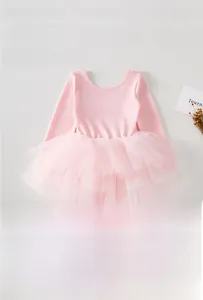 Close-up of pink long-sleeve ballet leotard with layered fluffy tulle tutu skirt