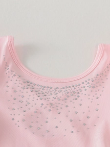 Pink girls ballet leotard dress featuring a round neckline and sparkling rhinestone details