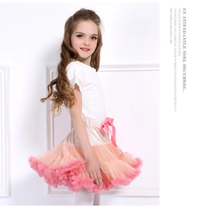 Detail view of multi-layered pink tutu skirt with silk bow for girls' princess outfit