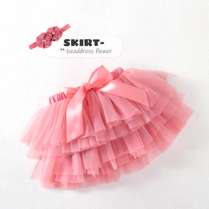 Pink girl's tutu skirt set with tiered tulle and matching floral headband accessory