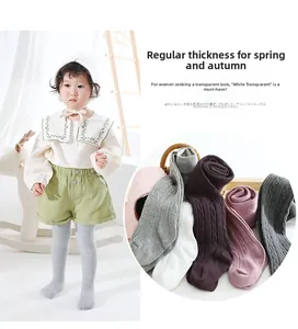 Detail of girls' cable knit leggings in multiple colors with soft ribbed cotton texture