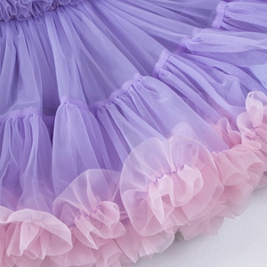 Detail of layered lavender tulle tutu skirt with soft pink ruffle hem for girls