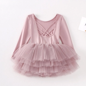 Detail view of girls pink ballet tutu dress featuring a back cross-strap cutout design