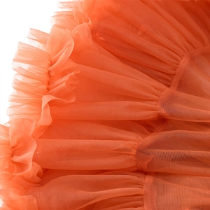 Vibrant orange layered mesh tutu skirt for girls with delicate tiered tulle fabric detail