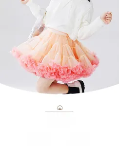 Detail view of the peach pink gradient layered tutu skirt with soft mesh fabric design