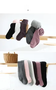 Detailed view of ribbed knit cotton tights for girls in various pastel colors