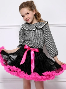 Girls' plaid top and black tutu skirt set with a vibrant pink bow and ruffle trim