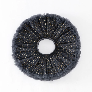 Close-up of charcoal grey tutu skirt with gold stars and layered mesh fabric detail