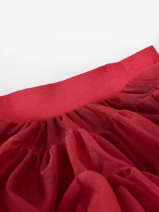 Elastic waist details of girls' bright red tutu skirt with multi-layered mesh fabric