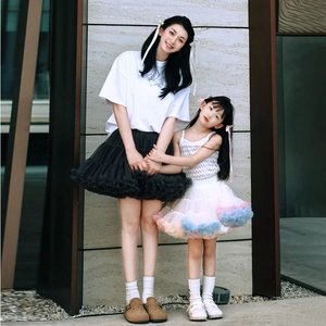Detail of layered tulle tutu skirts in black and colorful mesh for mother and child
