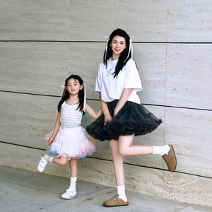 Detail of layered tulle tutu skirts for mother and daughter in stylish black and white