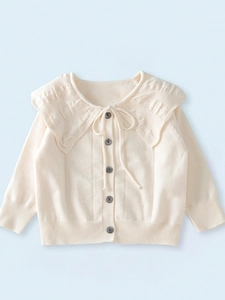 Cream knit cardigan with large ruffled collar and button front for baby girl
