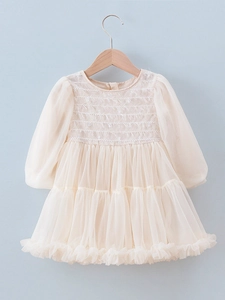 Elegant cream tulle tiered princess dress for girls with smocked bodice and long sleeves
