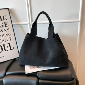 Minimalist large black faux suede tote bag with double handles for daily commute