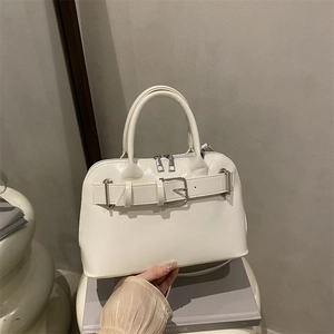 Chic beige PU leather handbag with dual handles and stylish buckle belt decoration