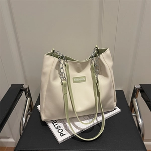 Minimalist large tote bag in off-white with green straps and silver chain decoration