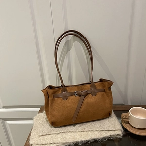 Brown vintage suede tote bag with metal buckle on knitted fabric, casual shoulder handbag