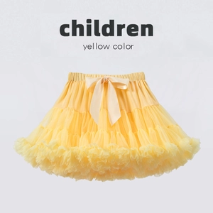 Detail of yellow tutu skirt with layered mesh tulle and a large satin bow on the waistband
